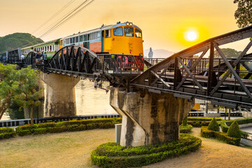 A train crossing The Bridge Over The River Kwai,at sunset,Kanchanaburi,Thailand.
