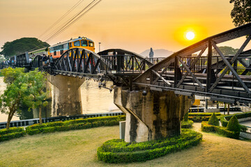 A train crossing The Bridge Over The River Kwai,at sunset,Kanchanaburi,Thailand.