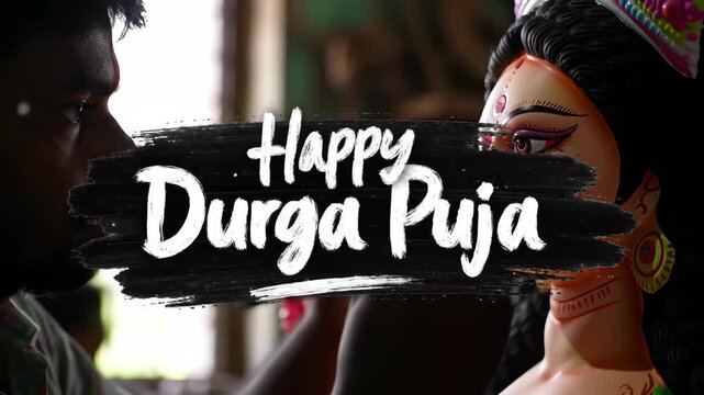 Artist painting the face of goddess durga idol for durga puja festival celebration in india durga puja
