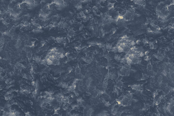 Textured dark blue and yellow cloud abstract background