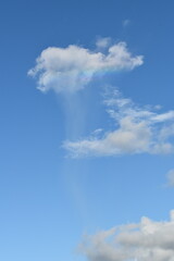Fototapeta premium Rainbow on a cloud in the sky in Trinidad and Tobago