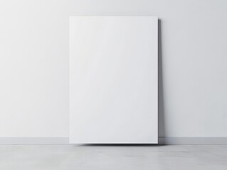 Minimalist blank white poster or s leaning against a smooth white wall on a clean gray floor with soft lighting for modern interior design or artistic display