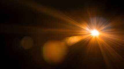 Dramatic golden light beams shining through darkness, creating an abstract bokeh effect. 