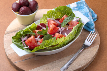 Sliced Baby Beetroot in a tomatoe and onion salad