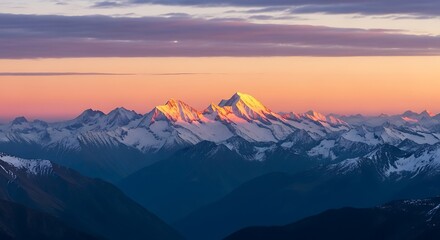 Majestic mountain range at sunset, with snow-capped peaks illuminated by golden light and a colorful sky.