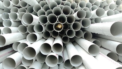 Close Up View of White PVC Pipes Stacked Together