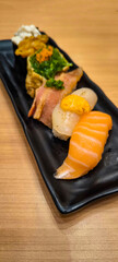 Sushi on a black plate Japanese food