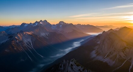 Aerial View of Mountain Range with Misty Valleys