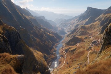 High-angle view of a mountain valley with winding river and paths