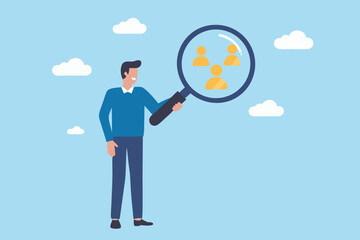 Man holding a magnifying glass to examine people icons representing recruitment and talent search