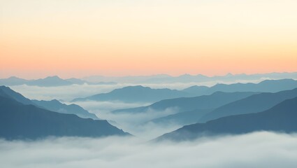 Fototapeta premium A serene view of mountains covered in mist at sunrise, showcasing the beauty of nature with its ethereal atmosphere and soft pastel colors in the sky