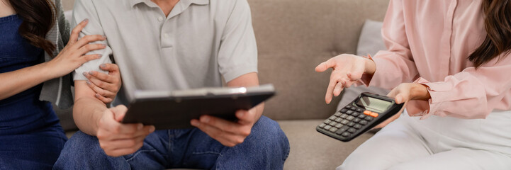 Fototapeta premium Expert Asian financial advisor meets adult couple home discussing comprehensive investment plans retirement strategies future goals