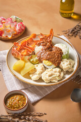 Plate of siomay with side dishes suitable for food blogs, restaurant menus, asian cuisine articles, indonesian cuisine promotions, cooking magazines.