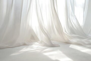 Obraz premium Elegant white sheer curtains flowing in sunlight create a soft ethereal backdrop