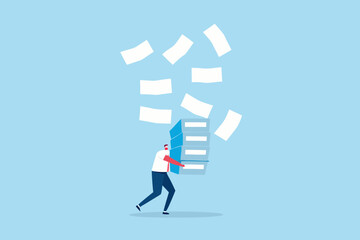 Man struggling to carry a large stack of documents with papers flying around him