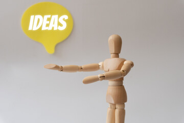 Wooden mannequin, showing the word ideas in a speech bubble