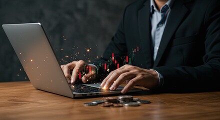 Businessman in a suit analyzing financial stock market data on a laptop with a glowing chart overlay.