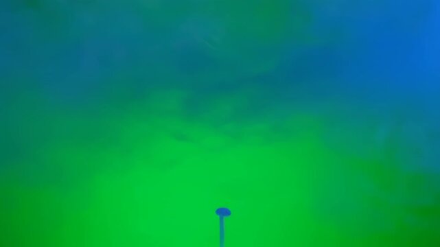 A window pane shattering inward with realistic force and debris, captured on a vibrant green screen background shockwave, energy, vibrant green screen