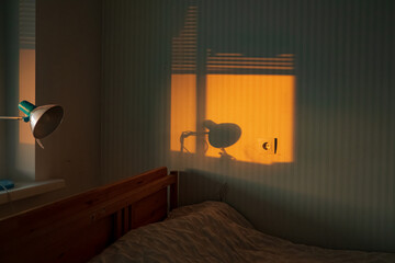 Golden sunlight streams through curtains, casting lovely shadows and a serene ambiance