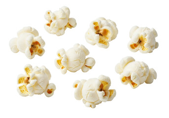 Fototapeta premium Bright white, fluffy, fully-popped popcorn kernels scattered on a transparent background with copy space, captured with macro lens effect and bright studio lighting, concept of classic comfort and