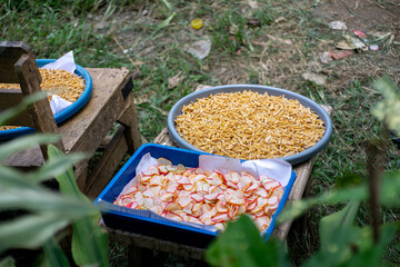 Traditional Indonesian Raw Crackers or Kerupuk Being Sun-Dried Before Frying