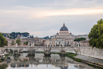 Fototapeta premium View of St. Peter's Basilica and the bridge over the Tiber River in Rome