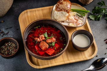 Traditional Ukrainian borscht with meat, bread and sour cream