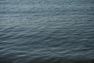 Surface of the Black Sea with natural ripples and soft blue-gray tones. The calm water texture is ideal for use as a background, design element, or for illustrating ocean, sea, or nature concepts