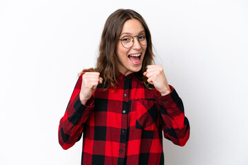 Naklejka premium Young caucasian woman isolated on white background celebrating a victory in winner position
