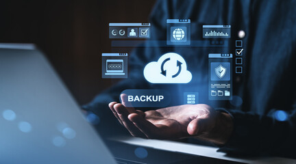 Cloud data backup and storage concept with digital icons above open hands.