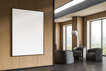 Modern interior lounge with large vertical poster mockup on wood wall and city view through glass windows in a cozy seating area. 3D Rendering