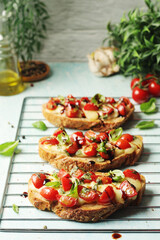 Freshly made bruschetta sandwiches - traditional dish of Italian cuisine	