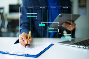 Hands typing on laptop with a digital Gantt chart overlay. Ideal for project planning, scheduling, productivity, workflow, in office