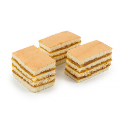 Close-up of layered sponge cake slices with golden fruit jam filling on a white background. Tasty sweet dessert, perfect for bakery, confectionery, menu design, and product food photography
