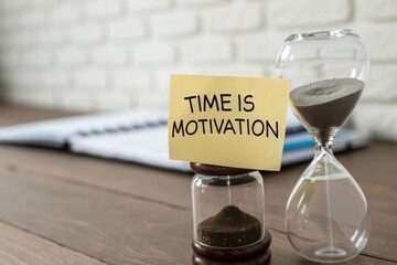 Time Management Concept with Hourglass, Sticky Note, and Notebook on Wooden Table for Motivation and Productivity Tips