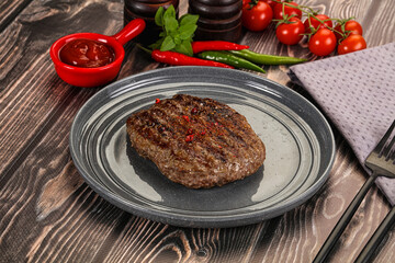 Grilled beef burger cutlet with sauce