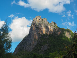 View of limestone mountains in the forest during the rainy season   