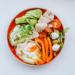 Breakfast with eggs, avocado and tomatoes