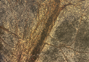 Close up natural granite stone marble with dark veins and grey tone color. Mineral stone with abstract veins for exotic exterior floor and wall finishes. Seamless background texture.