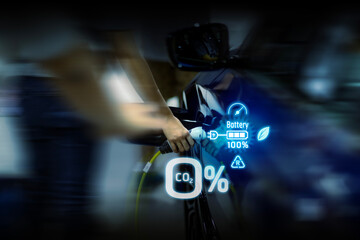 Power cable pump plug in charging power to electric vehicle EV car.