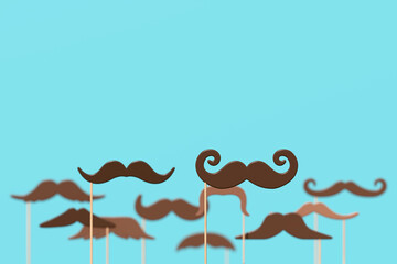 Men's health awareness month. Many brown moustaches on wooden sticks against blue background. Supporting men's health during November month. 3d illustration, render