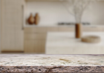 Empty marble top table with blurred kitchen interior Background. for product display.