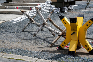 Military style steel, wood and barb wire roadblocks