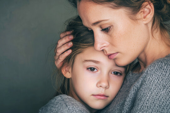 Emotional moment between mother and daughter as they comfort eac