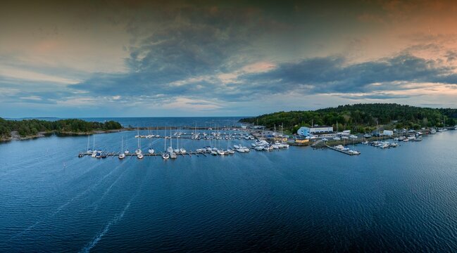 panorama drone view of the yacht harbor and marina of Karlshamn in southern Sweden at sunset