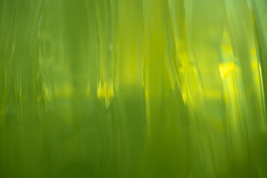 abstract glowing green background with ripples - Powered by Adobe