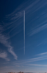 Vapor traol of airplane over Saudi Arabia desert