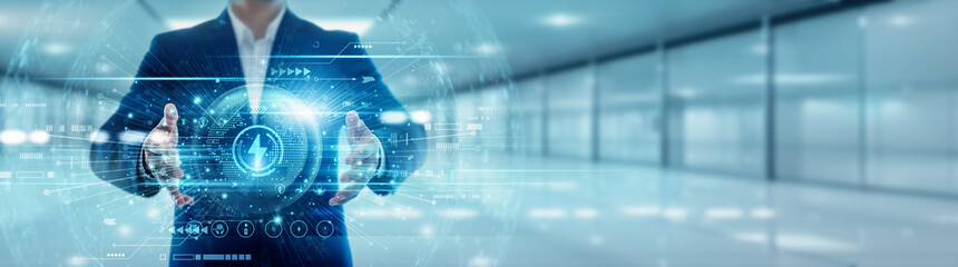 Energy technology person holds a global power globe with a network connected to energy technology....