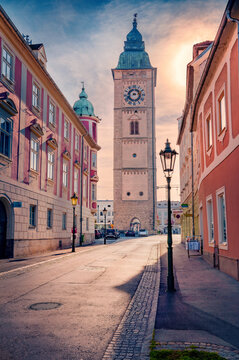 Picturesque evening view of Stadtturm Enns - populr tourist attraction, 157 meters Enns town tower. Attractive autumn sunrise in Enns town, state of Upper Austria. Traveling concept background.