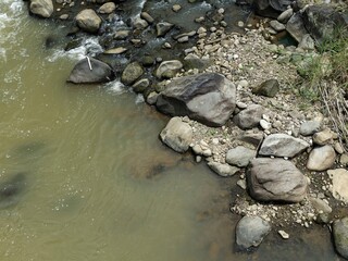 natural scenery of a rocky river during summer in Indonesia